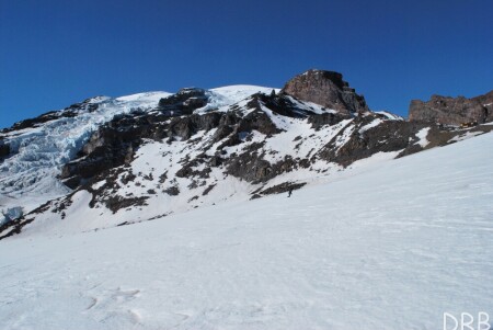 Dave carving turns on the lower flanks of a very big mountain